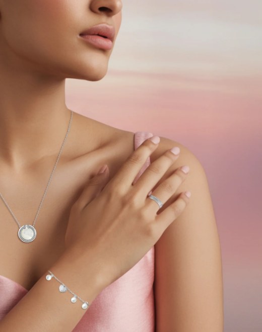 Model wearing a Mhoir sterling silver necklace, ring and bracelet